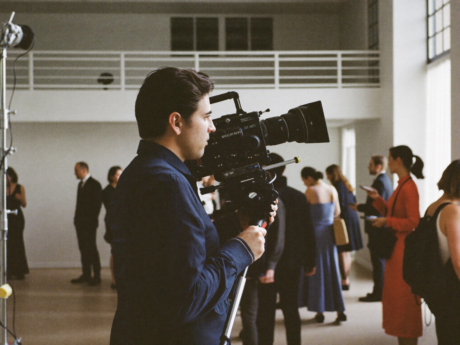 Axon crew on set with a cinema camera