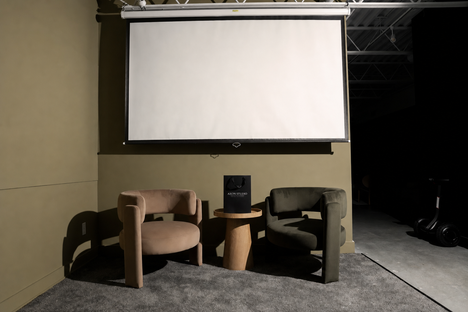 Private screening corner with velvet barrel chairs