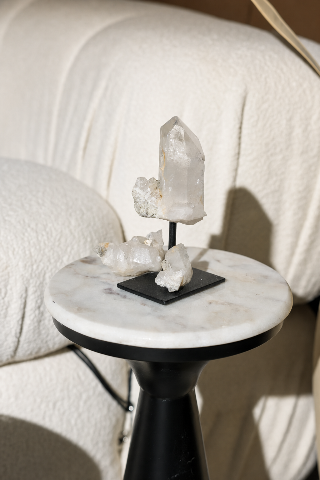 Quartz crystal styled on a marble side table