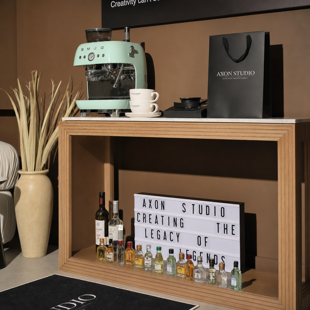 Mint espresso machine on the oak console with the AXON STUDIO lightbox
