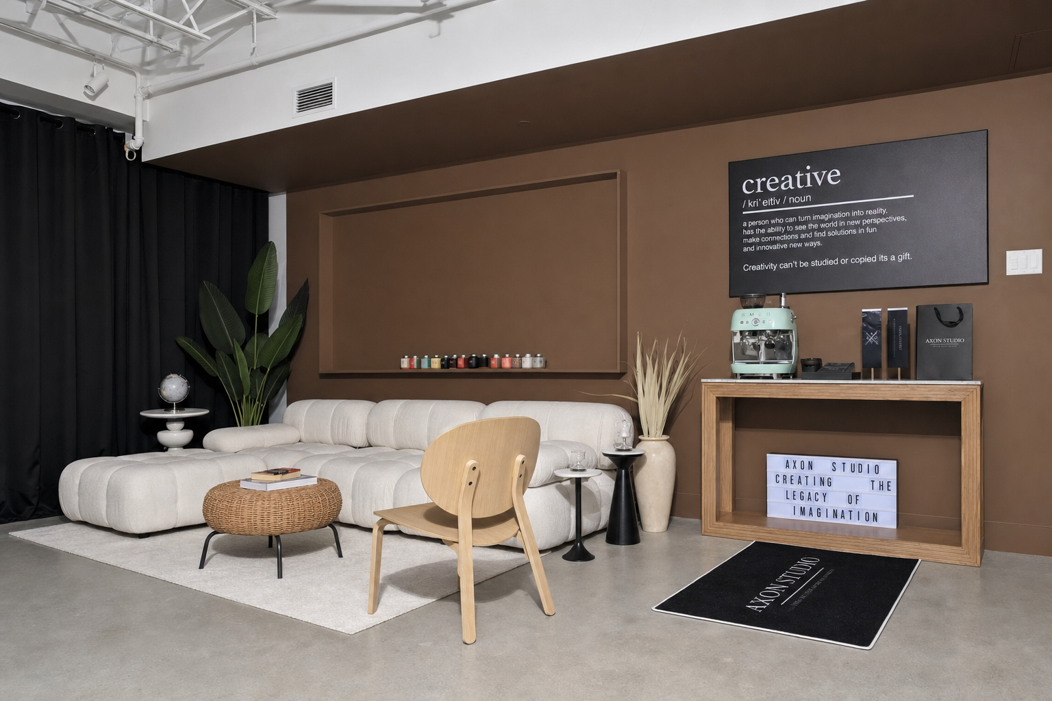 Studio lounge with a mocha feature wall and cream modular sofa